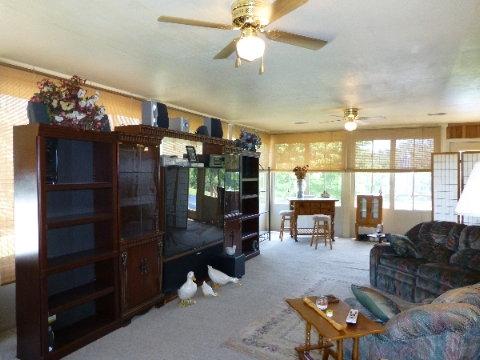 1666 Council Bend Road Centerville, TN 37033 - Photo 3 of 18 The sunroom is heated & cooled - located right off the dining room/kitchen. The sectional can remain with the home ~ the electric fireplace is negotiable