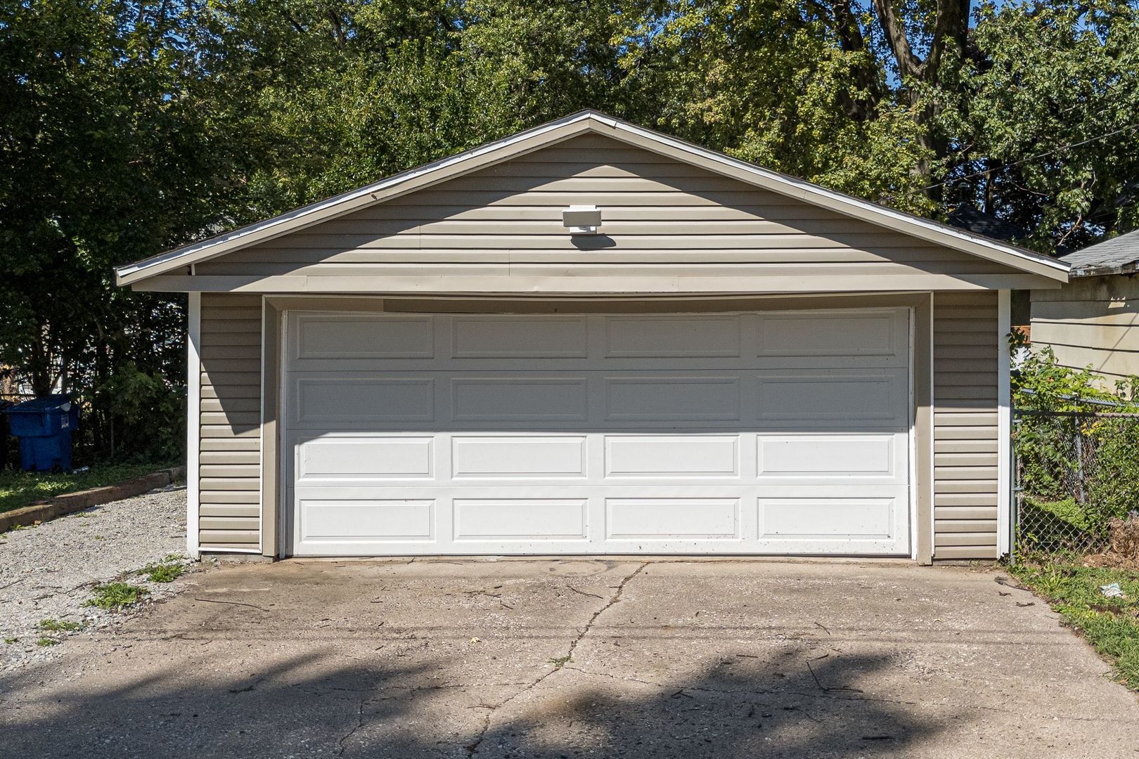 2522 5th Avenue Moline, IL 61265 - Photo 5 of 6 a small white house with a large space and a forest view
