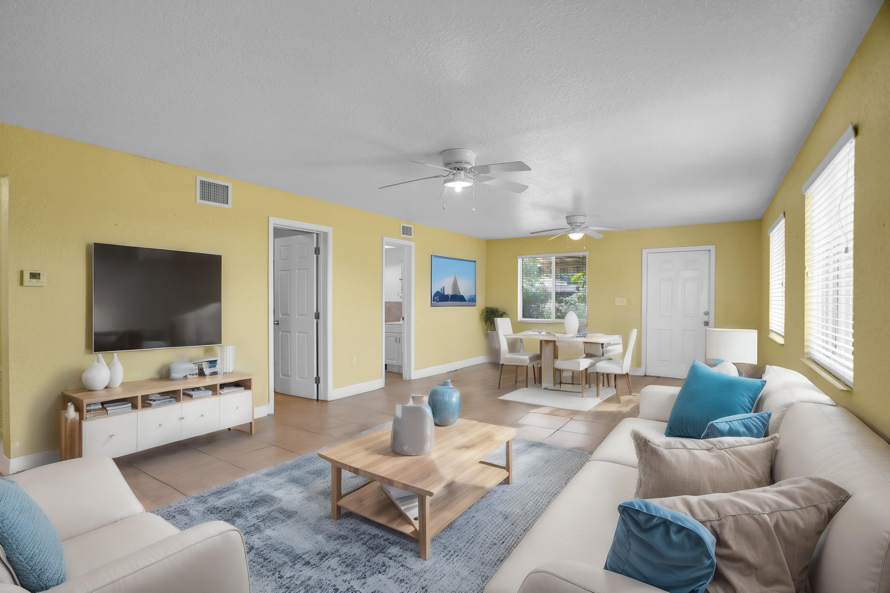 424 Southwest 64th Court Miami, FL 33144 - Photo 19 of 44 a living room with furniture and a flat screen tv