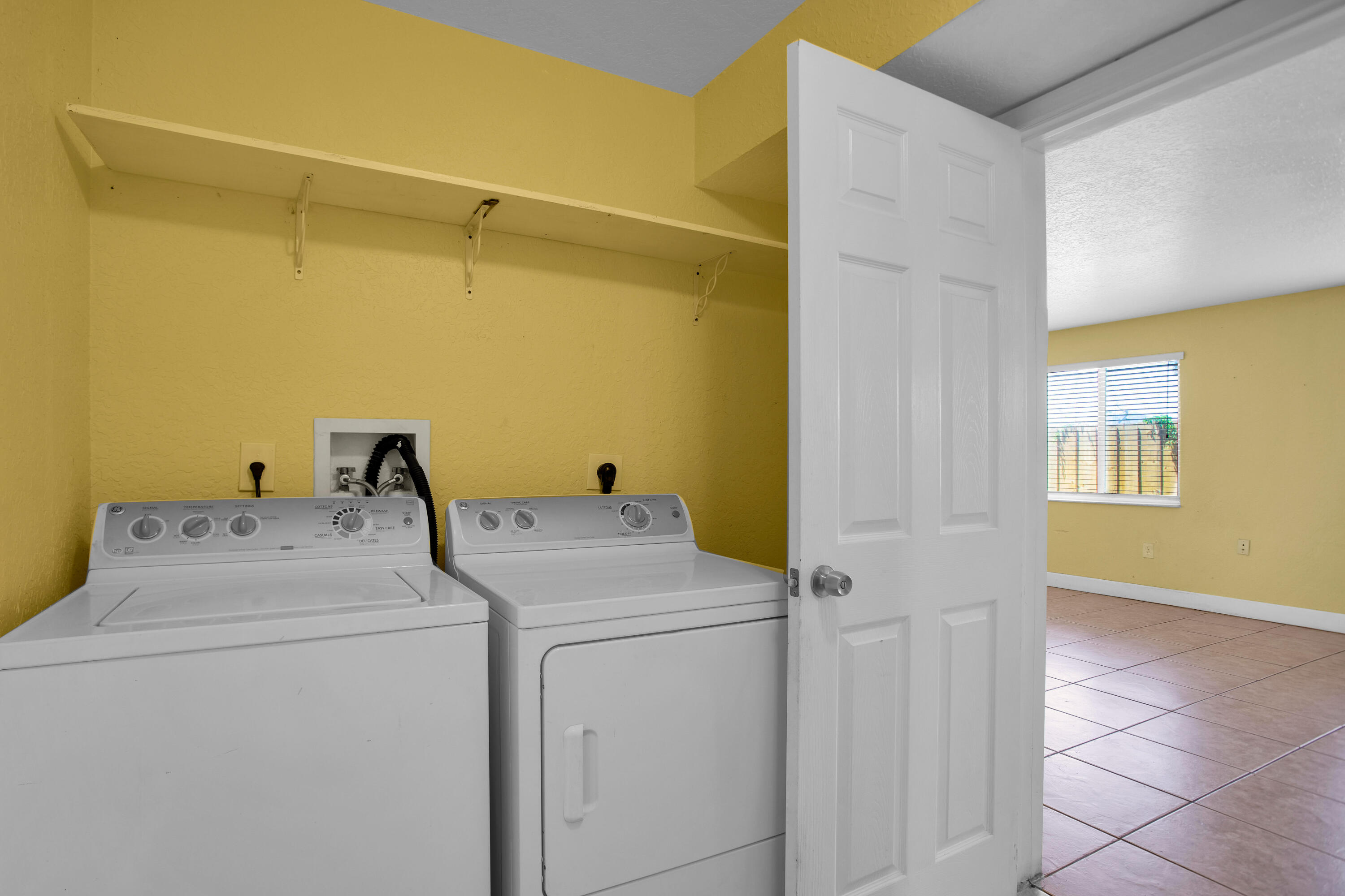 424 Southwest 64th Court Miami, FL 33144 - Photo 25 of 44 a utility room with dryer and washer