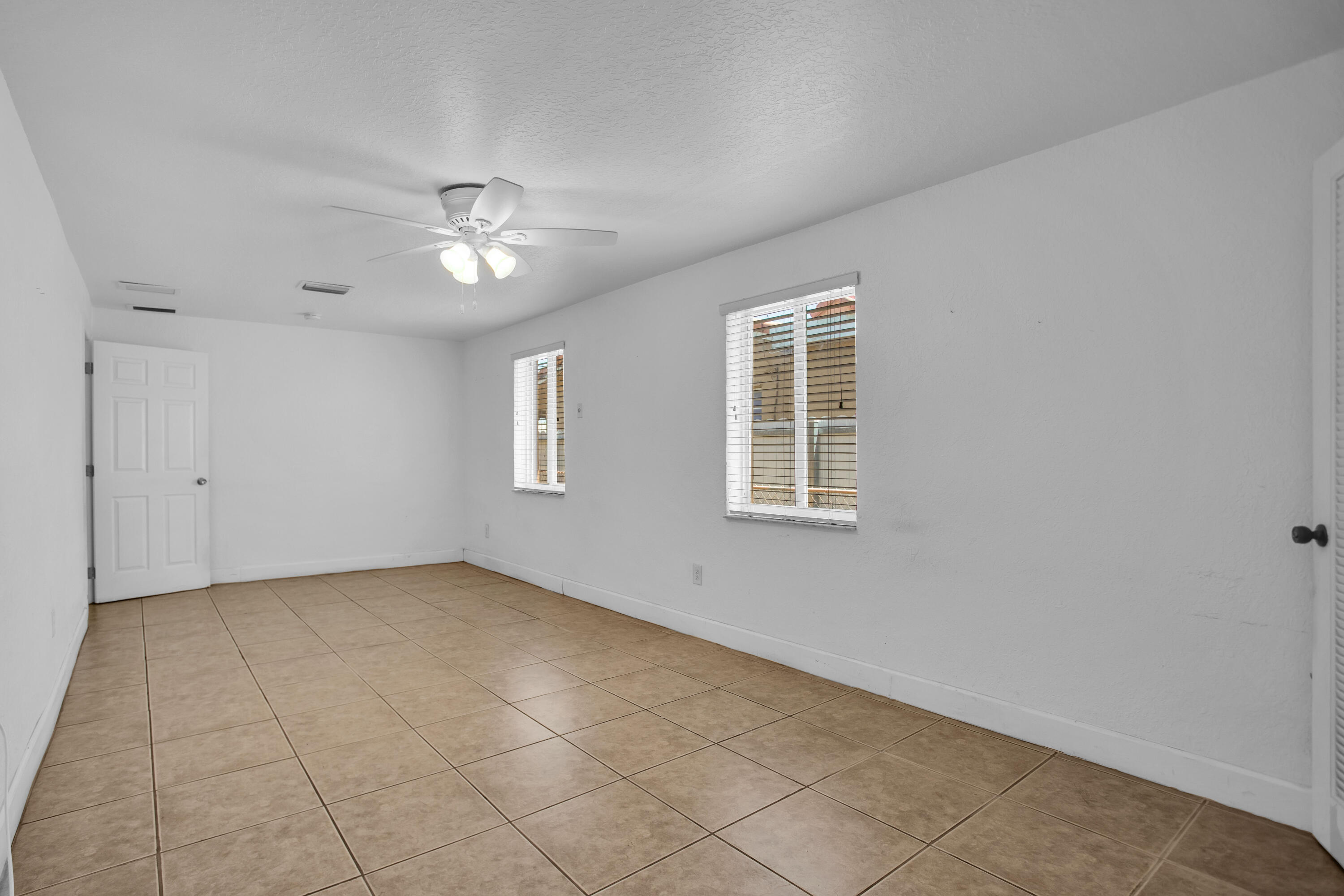424 Southwest 64th Court Miami, FL 33144 - Photo 29 of 44 a view of an empty room with a window