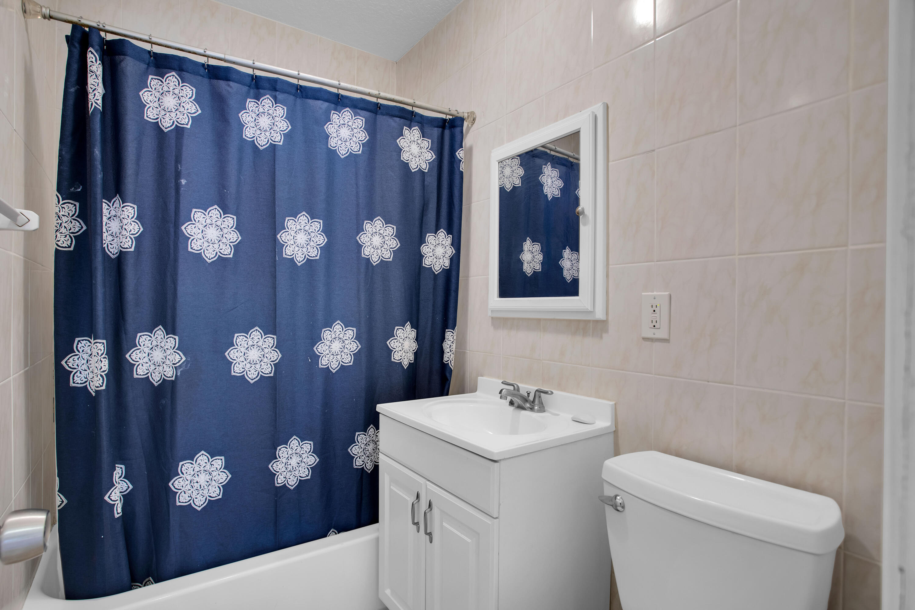 424 Southwest 64th Court Miami, FL 33144 - Photo 34 of 44 a bathroom with a toilet sink and mirror