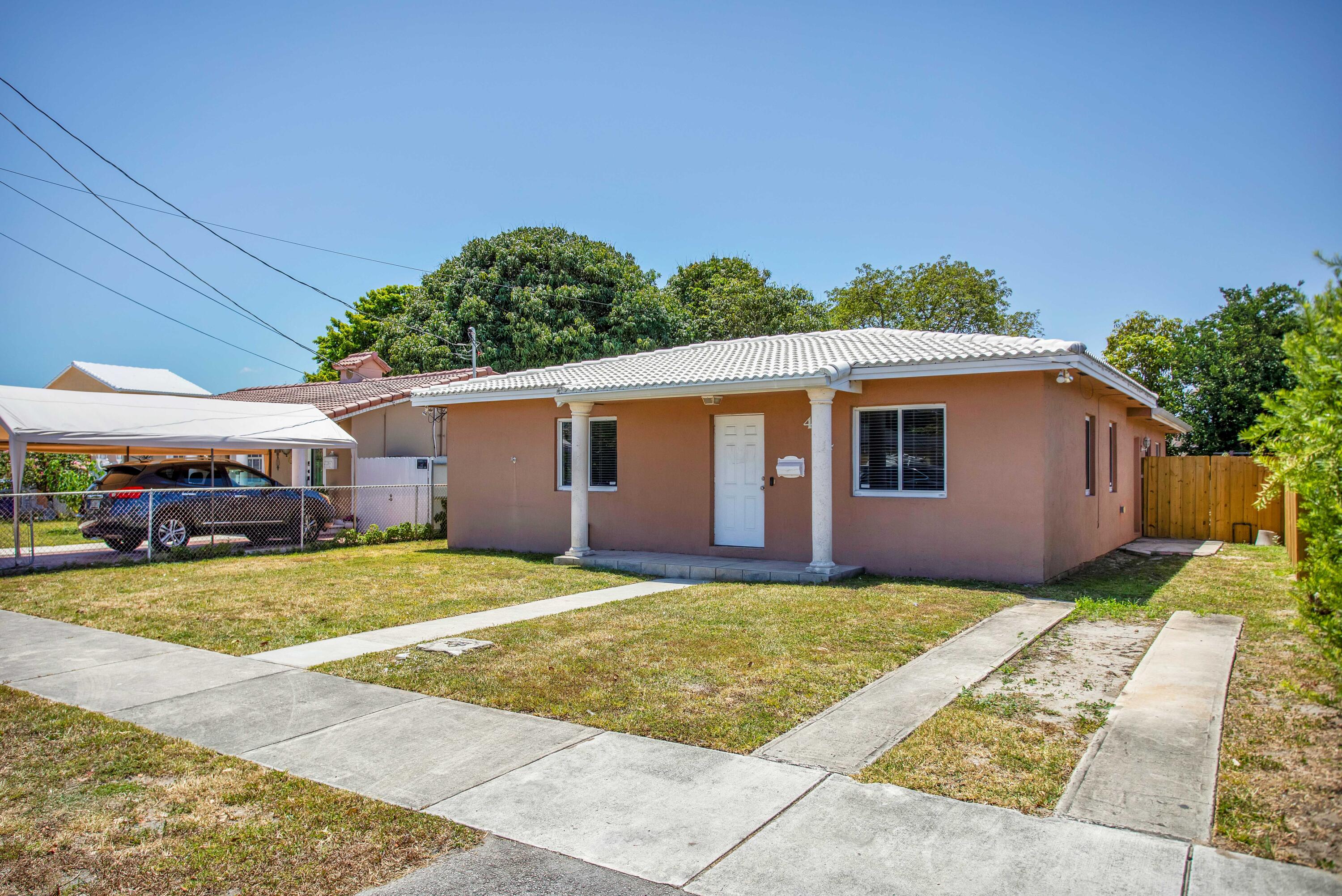 424 Southwest 64th Court Miami, FL 33144 - Photo 4 of 44 a view of a house with a patio