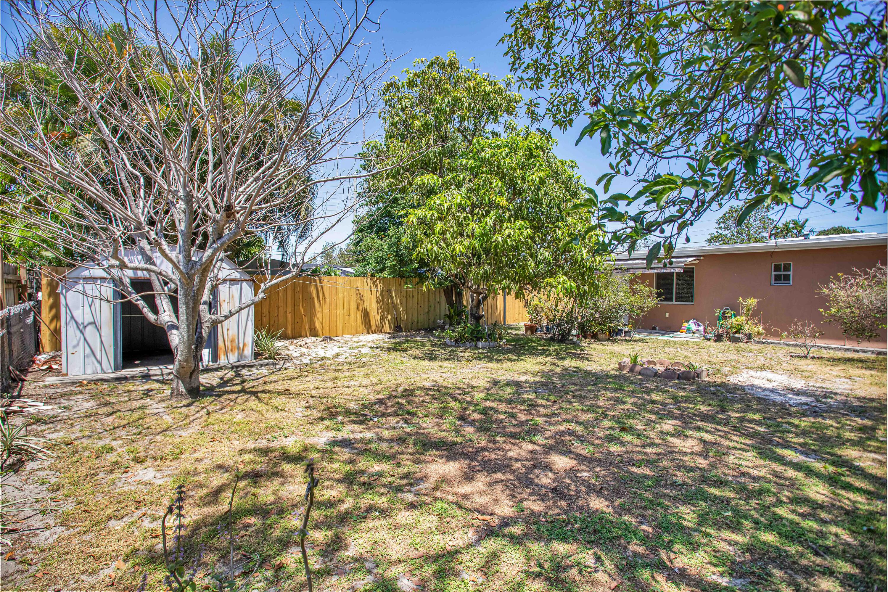 424 Southwest 64th Court Miami, FL 33144 - Photo 40 of 44 a view of a yard with large tree