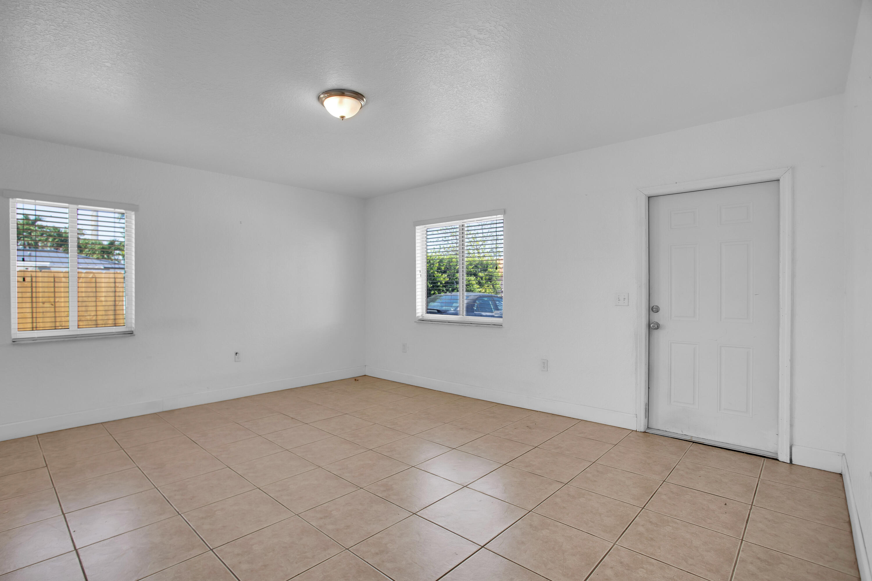424 Southwest 64th Court Miami, FL 33144 - Photo 7 of 44 an empty room with windows