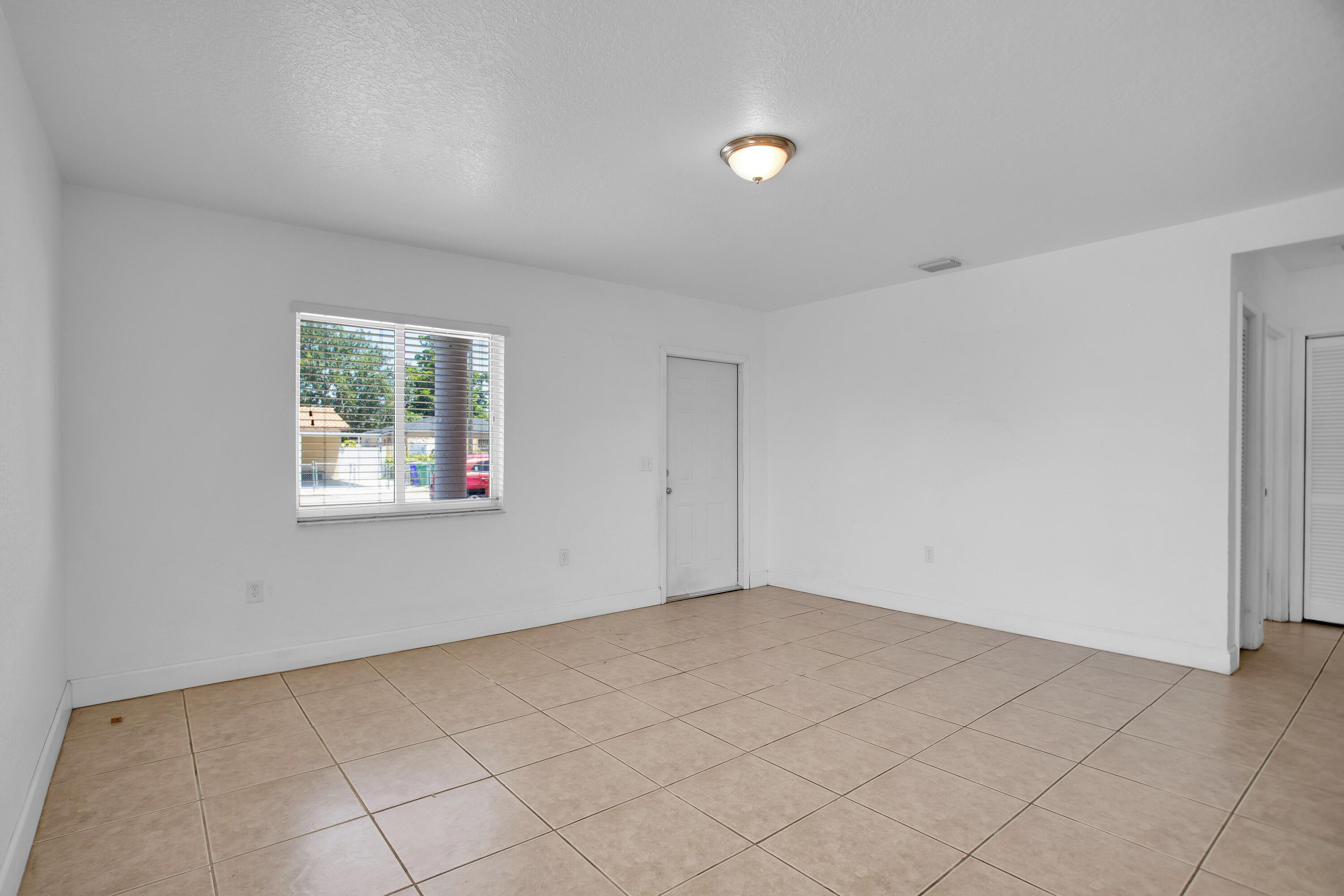 424 Southwest 64th Court Miami, FL 33144 - Photo 9 of 44 an empty room with windows