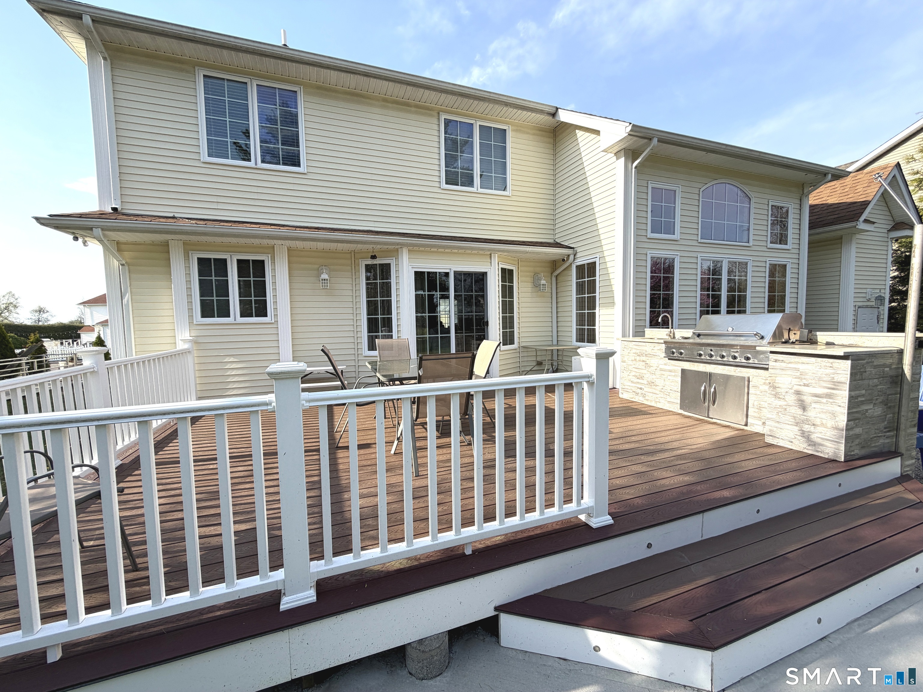 35 Emerald Pines Road Waterbury, CT 06704 - Photo 12 of 40 a view of a house with deck and wooden floor