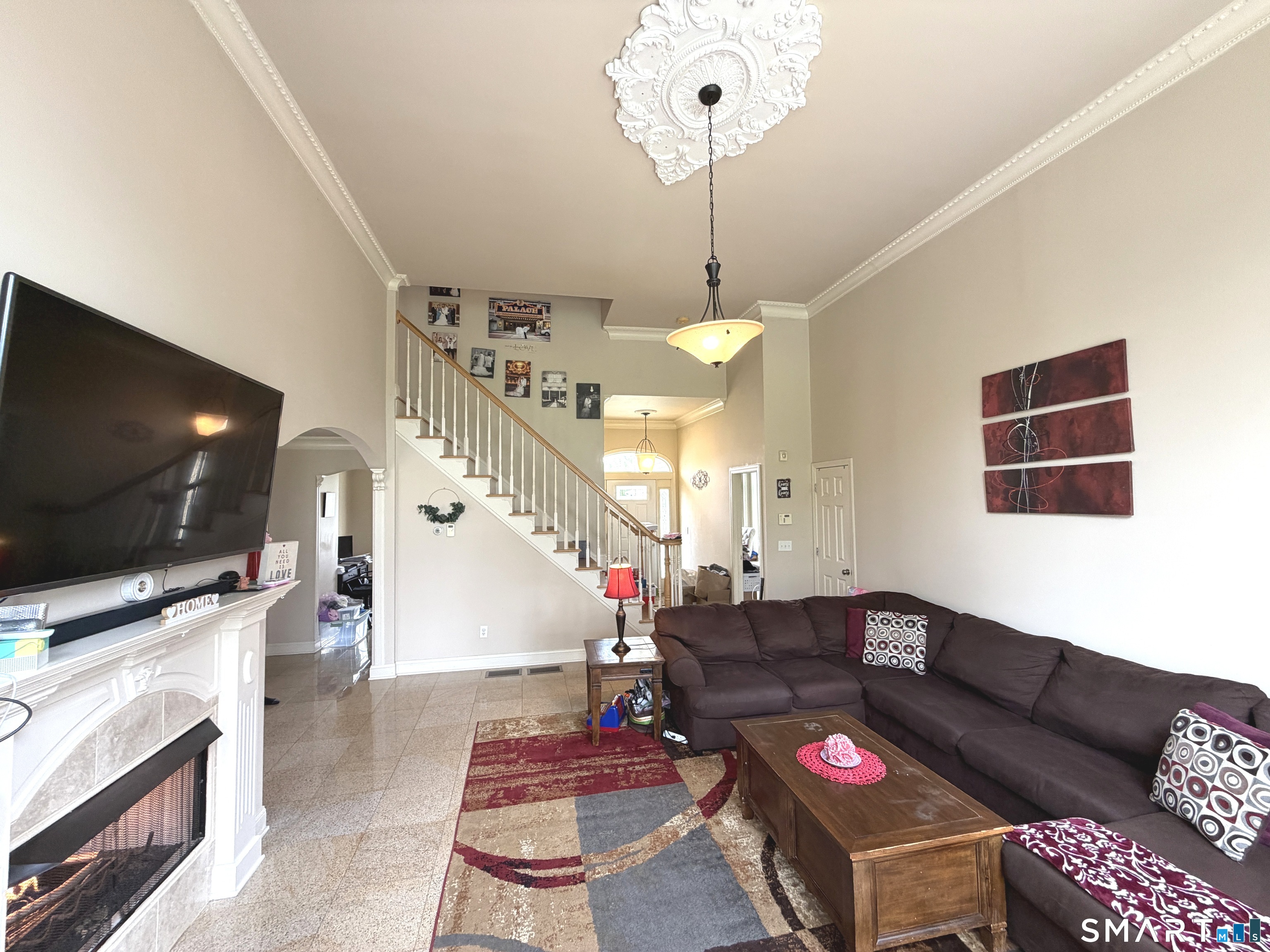 35 Emerald Pines Road Waterbury, CT 06704 - Photo 23 of 40 a living room with furniture and a flat screen tv