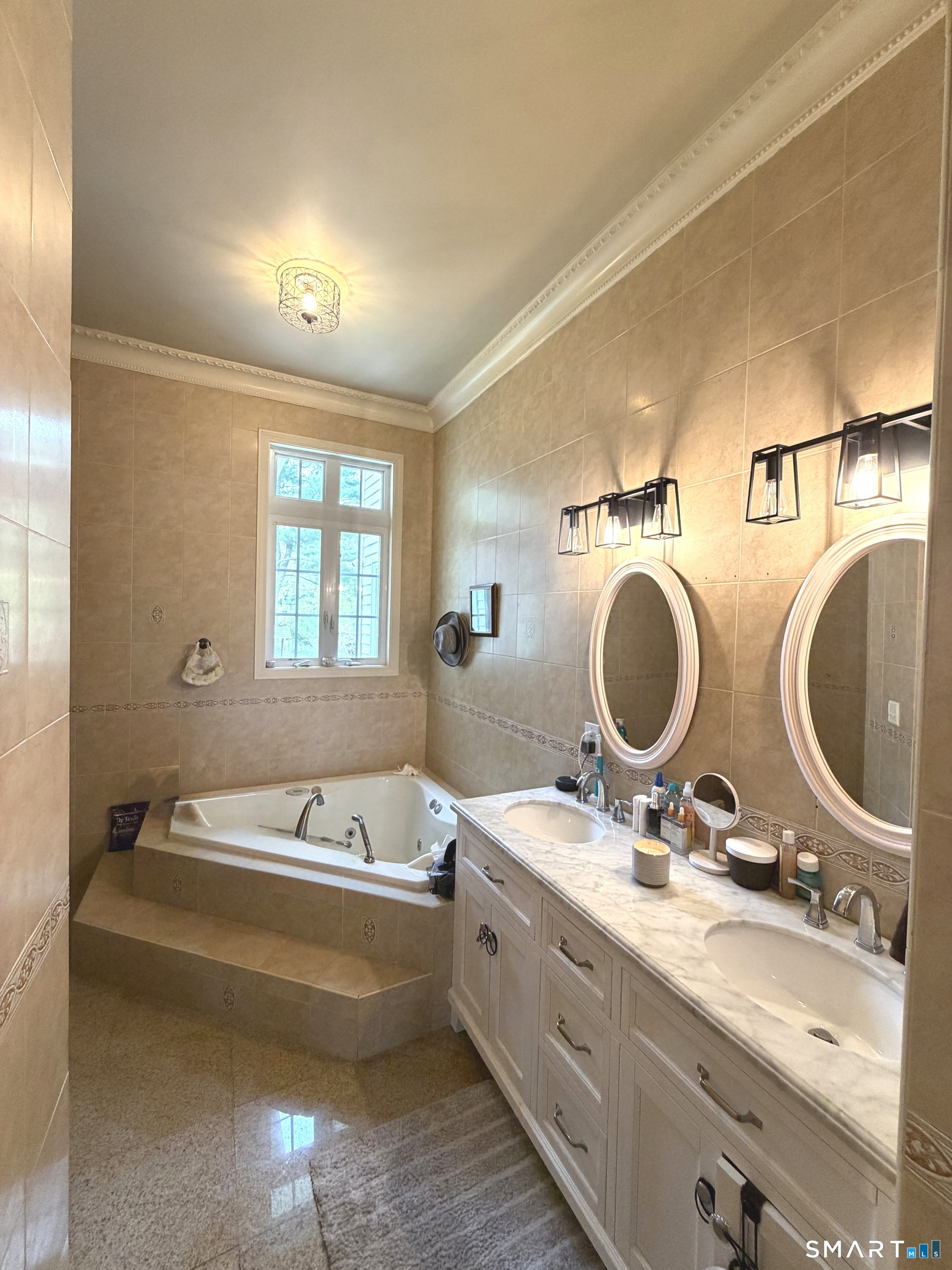 35 Emerald Pines Road Waterbury, CT 06704 - Photo 28 of 40 a bathroom with a double vanity sink and a mirror