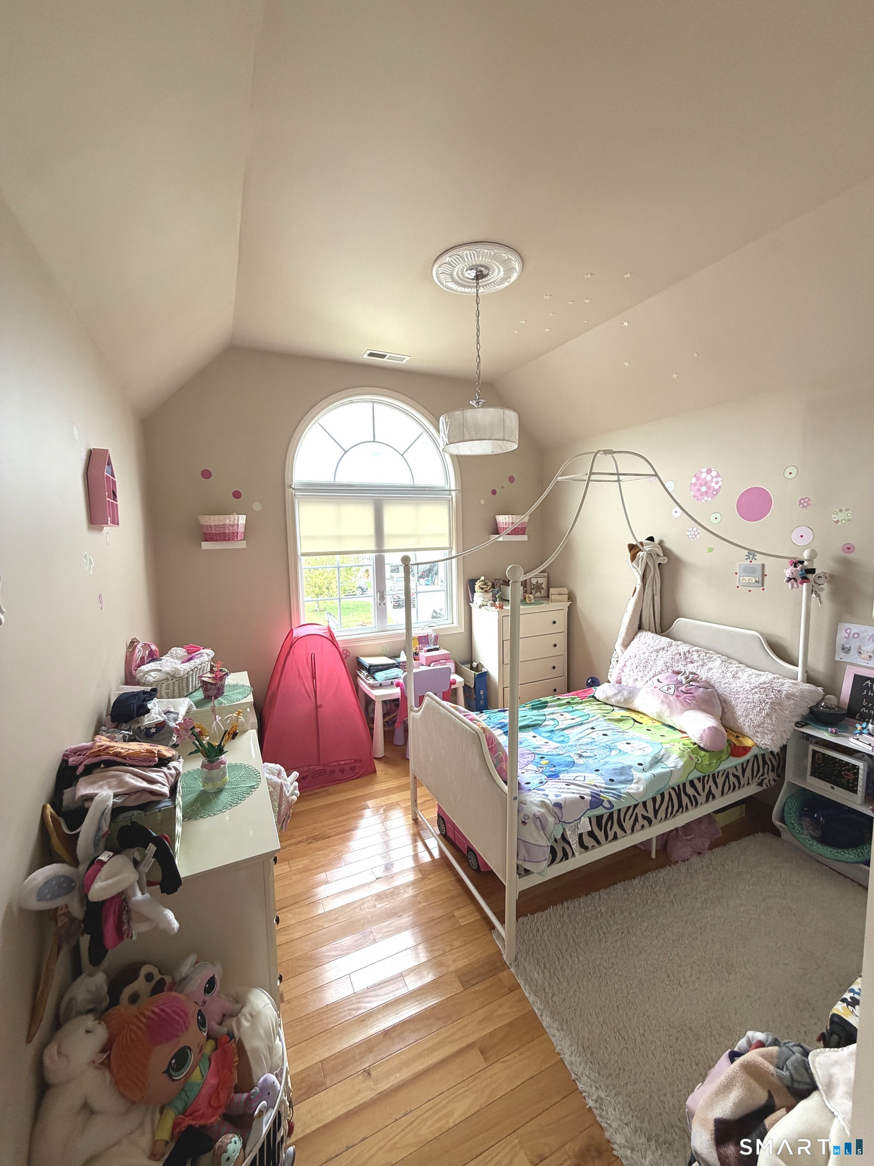 35 Emerald Pines Road Waterbury, CT 06704 - Photo 31 of 40 a bedroom with bed and a chandelier