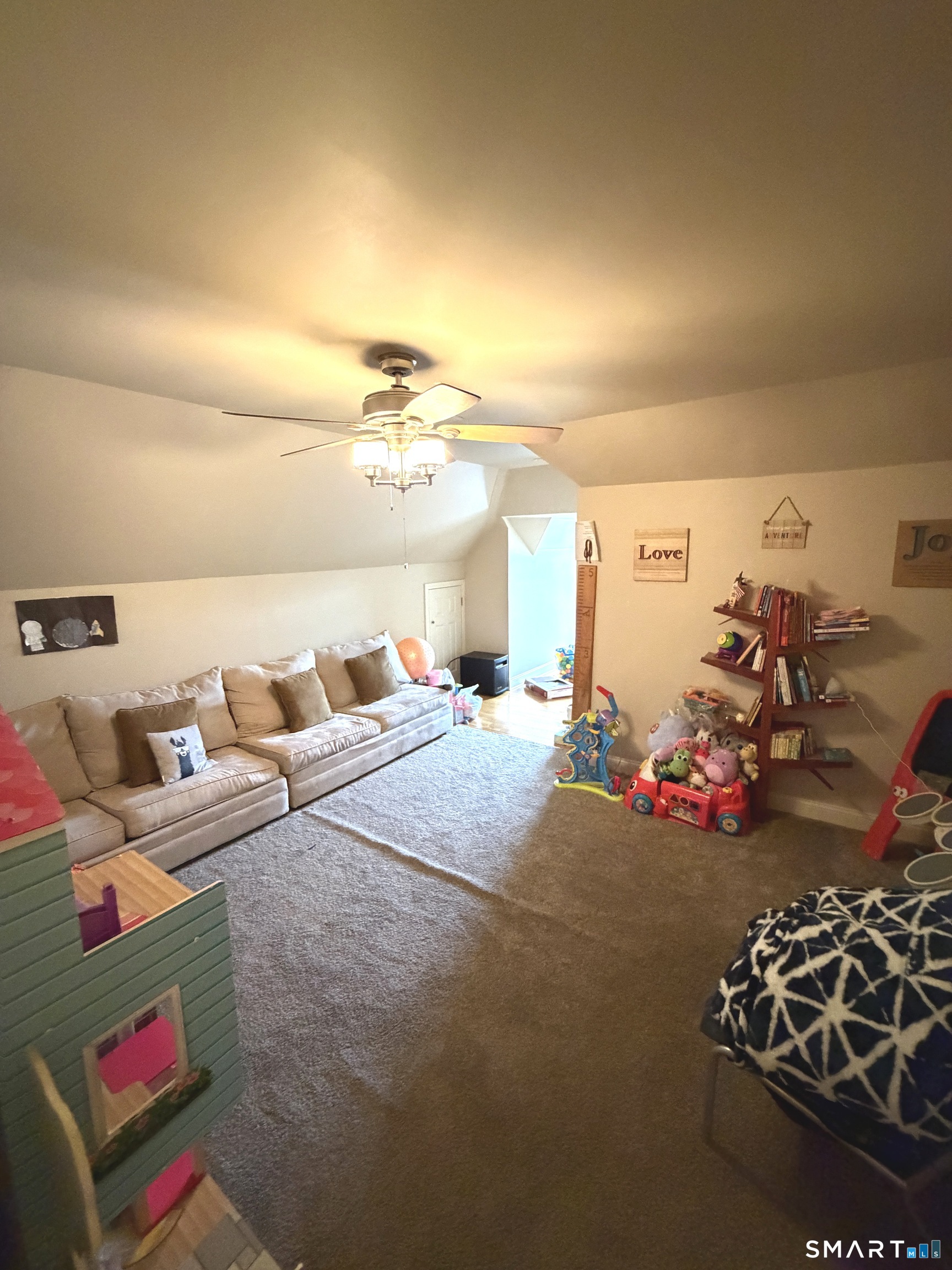 35 Emerald Pines Road Waterbury, CT 06704 - Photo 32 of 40 a bedroom with furniture and a chandelier