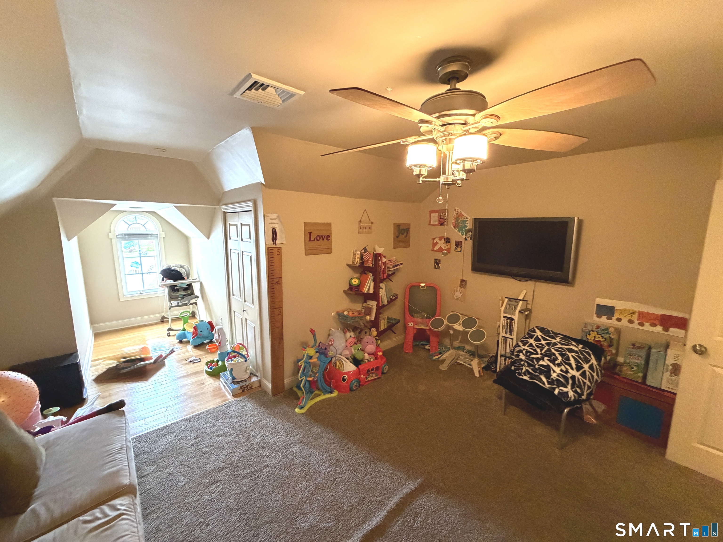 35 Emerald Pines Road Waterbury, CT 06704 - Photo 33 of 40 a bedroom with furniture and a flat screen tv