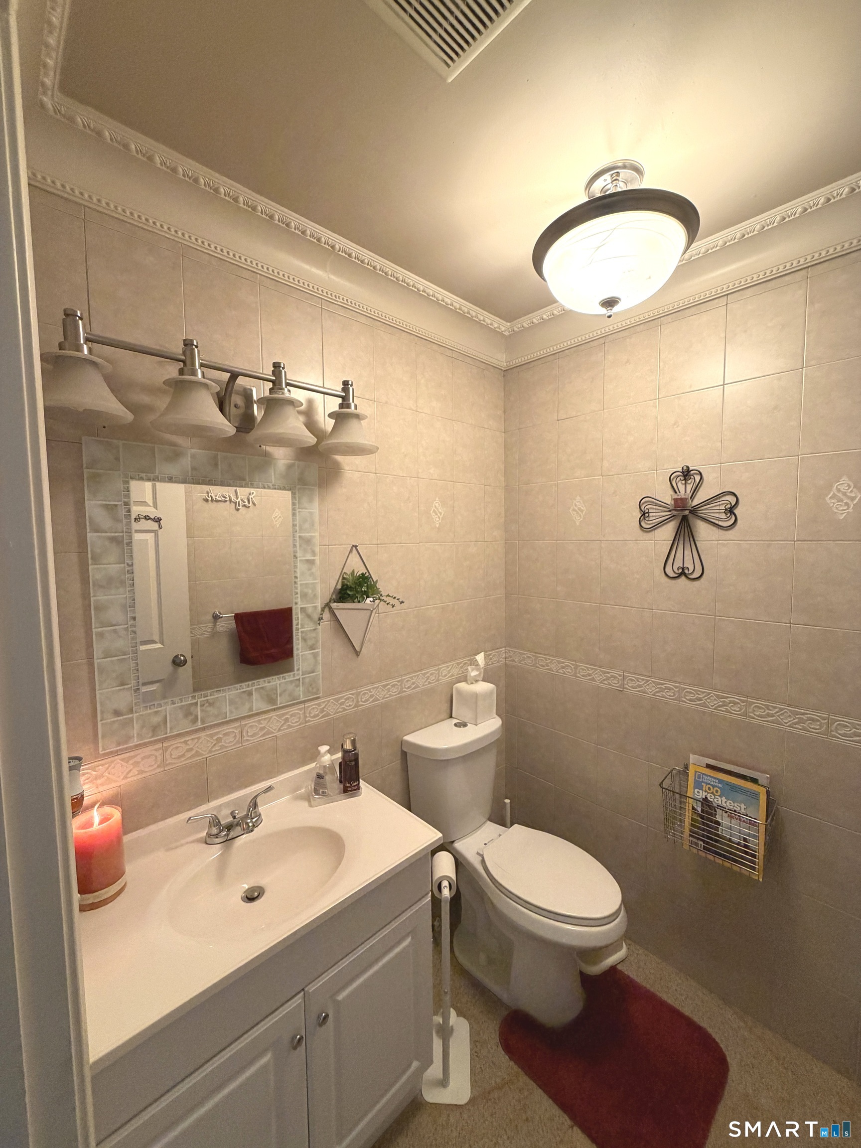 35 Emerald Pines Road Waterbury, CT 06704 - Photo 34 of 40 a bathroom with a sink a toilet and mirror