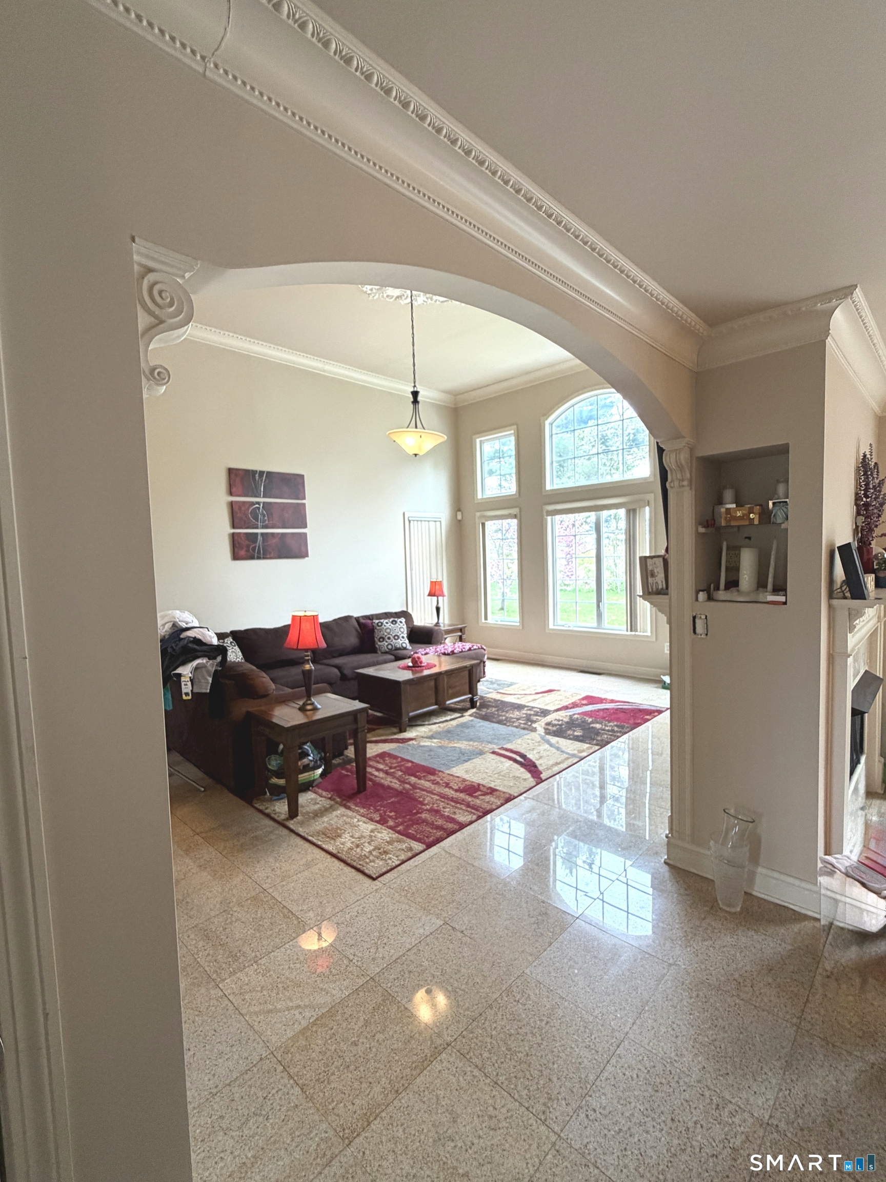 35 Emerald Pines Road Waterbury, CT 06704 - Photo 36 of 40 a living room with furniture dining table and a large window