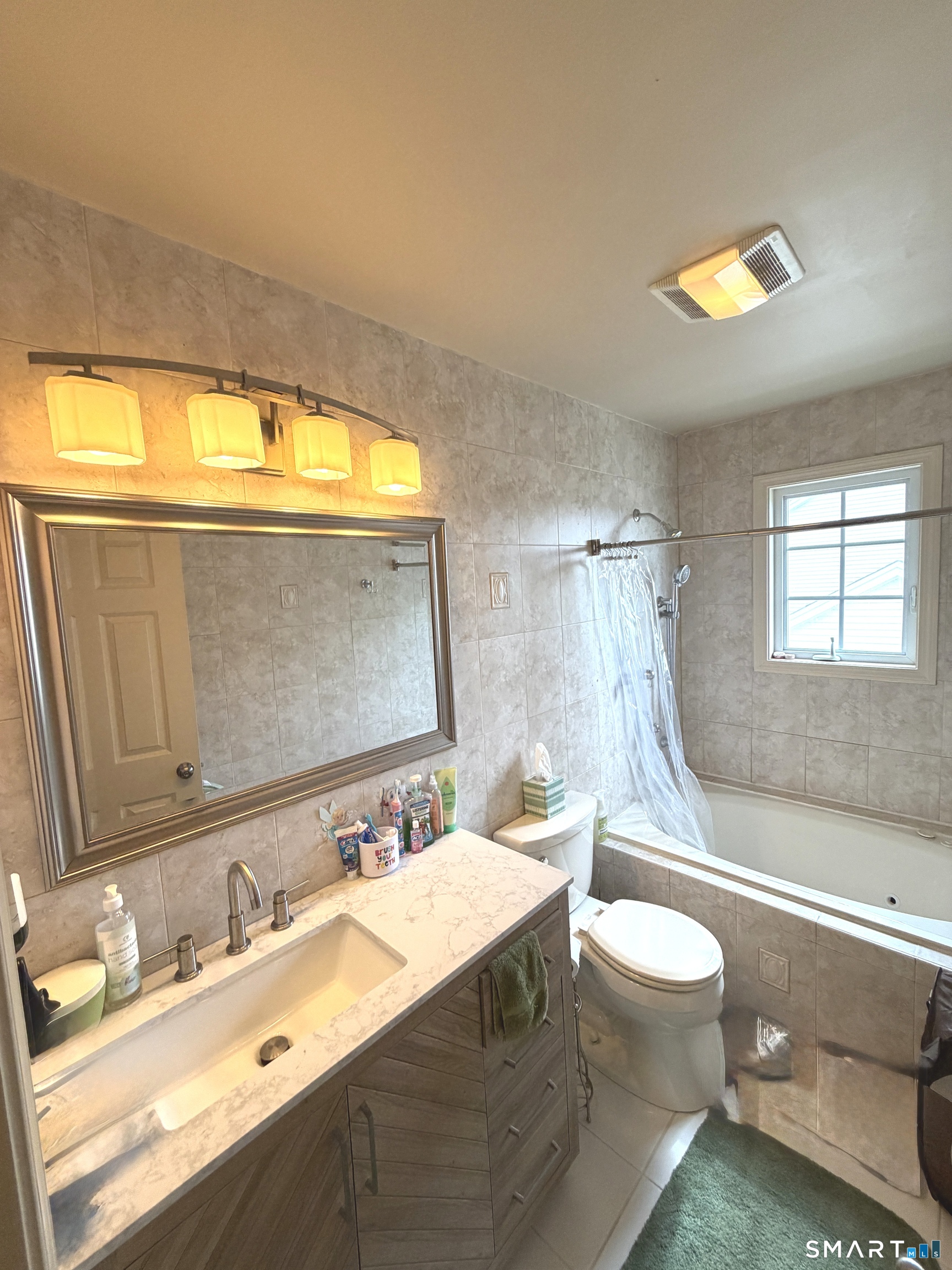 35 Emerald Pines Road Waterbury, CT 06704 - Photo 37 of 40 a bathroom with a double vanity sink toilet and a mirror