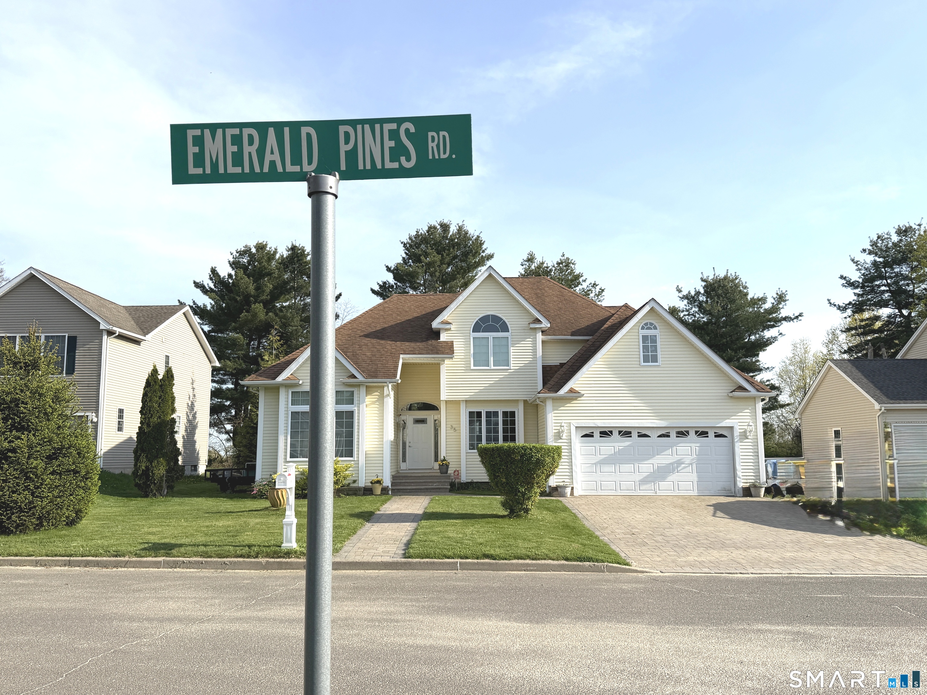 35 Emerald Pines Road Waterbury, CT 06704 - Photo 40 of 40 a view of a house with a yard and street