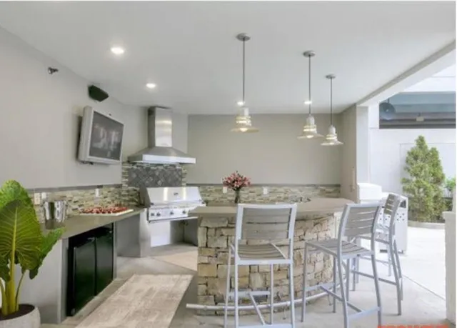 a kitchen with a table and chairs in it
