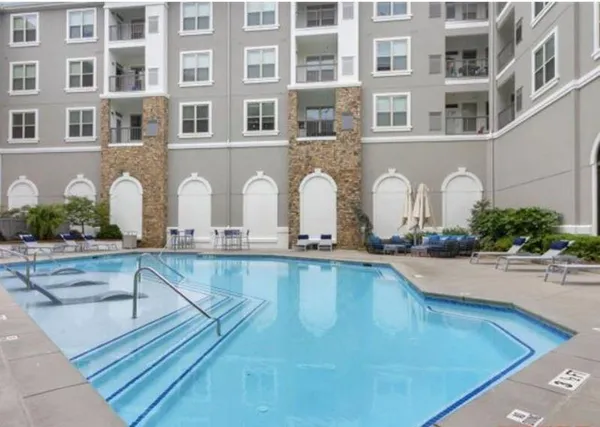 a view of a swimming pool with outdoor space