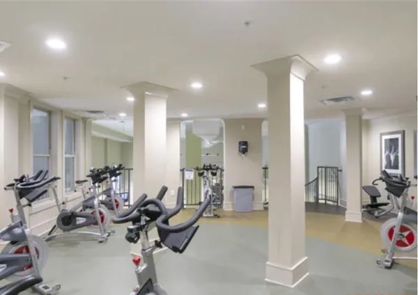 a living room with furniture a dining table and chairs