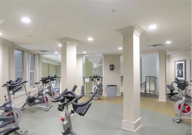 a living room with furniture a dining table and chairs