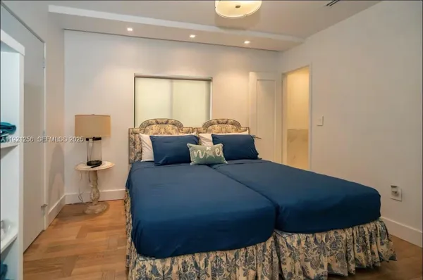 a bed room with a bed and a window