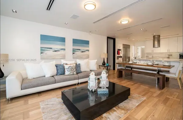 a living room with furniture and a table