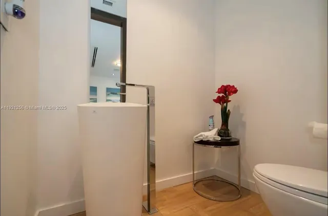 a bathroom with a toilet and a sink