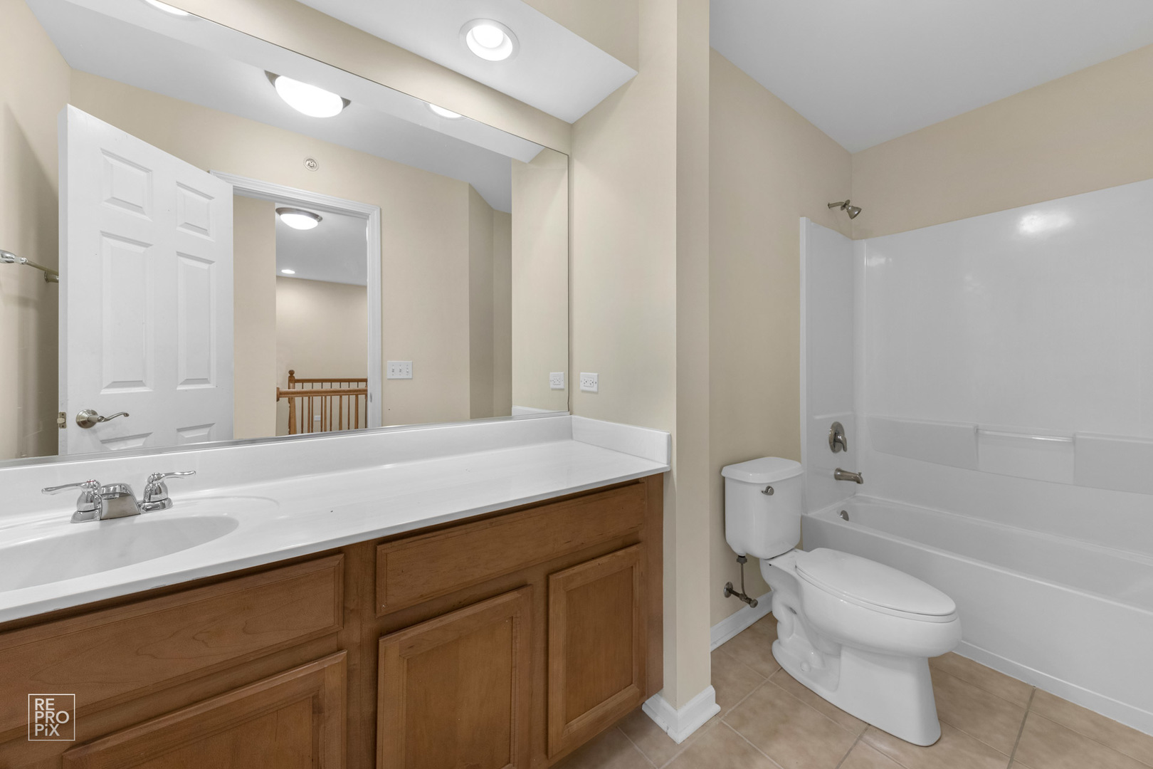 6400 Cunningham Court Gurnee, IL 60031 - Photo 14 of 19 a bathroom with a granite countertop toilet sink and mirror