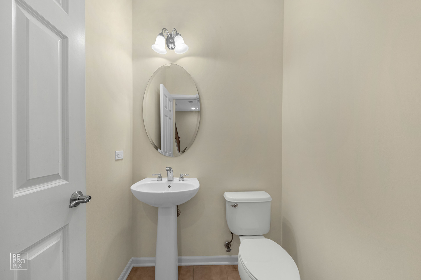 6400 Cunningham Court Gurnee, IL 60031 - Photo 15 of 19 a bathroom with a toilet sink and mirror