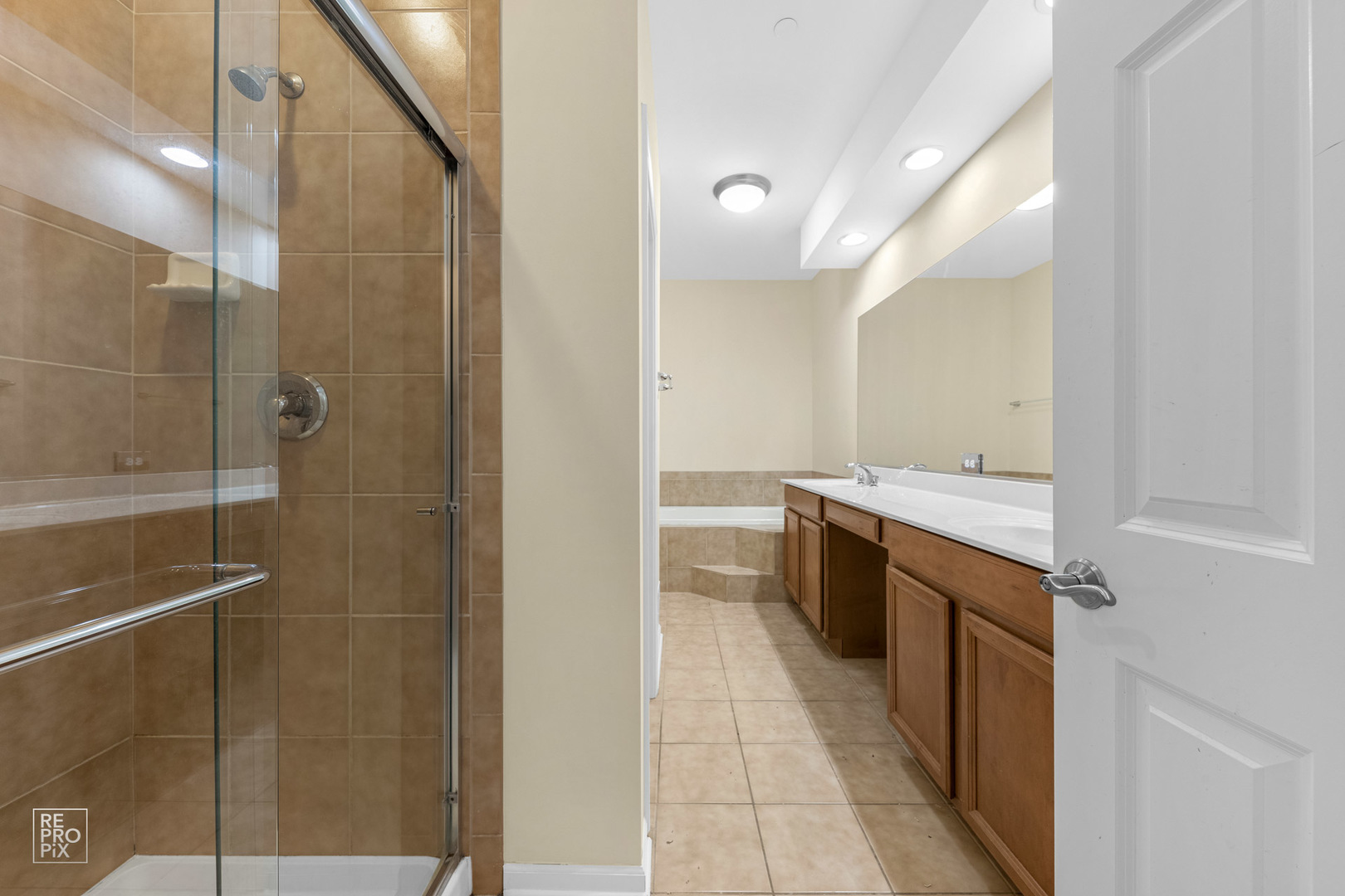6400 Cunningham Court Gurnee, IL 60031 - Photo 16 of 19 a bathroom with a double vanity sink a toilet and shower