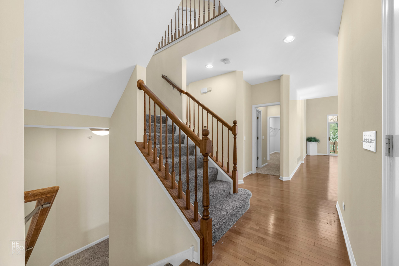 6400 Cunningham Court Gurnee, IL 60031 - Photo 10 of 19 a view of a hallway with wooden floor and staircase