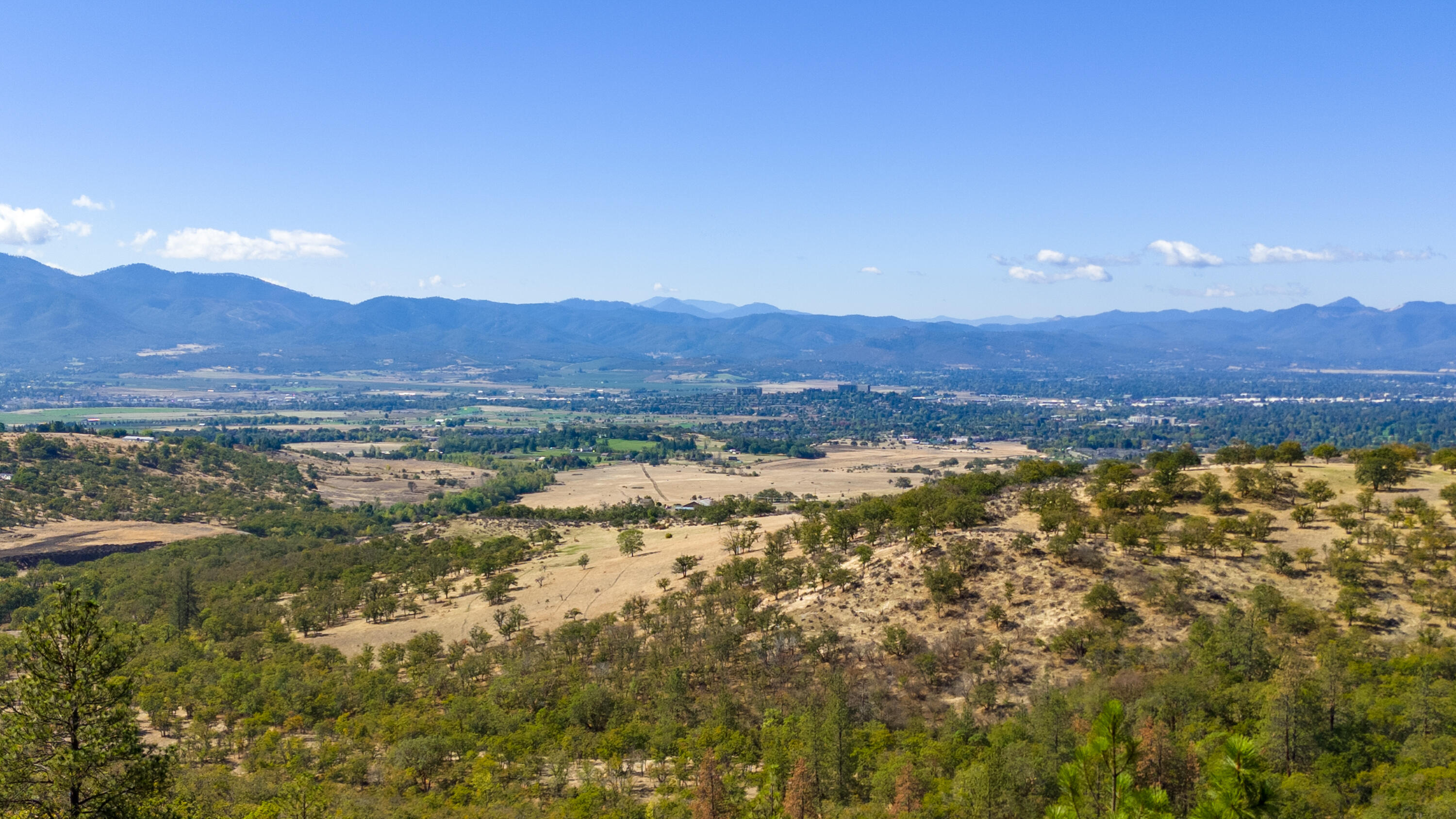 5880 Hillcrest Road Medford, OR 97504 - Photo 12 of 43 a view of a city with mountains in the background