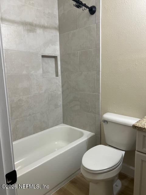 669 South Orange Street Starke, FL 32091 - Photo 4 of 12 a white toilet sitting next to a bath tub and a shower
