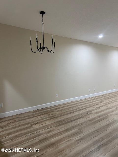 669 South Orange Street Starke, FL 32091 - Photo 5 of 12 a view of a room with wooden floor and ceiling fan