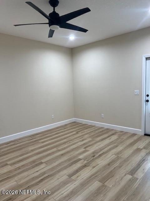 669 South Orange Street Starke, FL 32091 - Photo 9 of 12 a view of an empty room with wooden floor