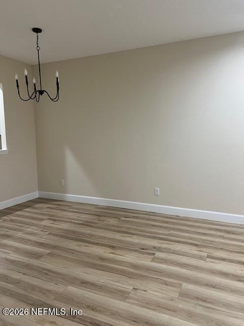 669 South Orange Street Starke, FL 32091 - Photo 10 of 12 a view of a room with wooden floor and windows