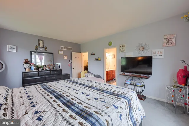 a view of a house with a yard and garage