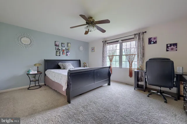 a view of house with backyard