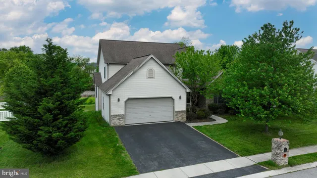 an aerial view of a house with a garden
