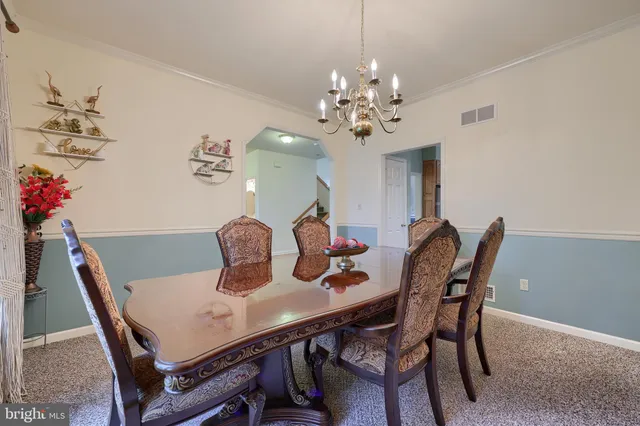 a kitchen with stainless steel appliances granite countertop a refrigerator a sink dishwasher stove and oven