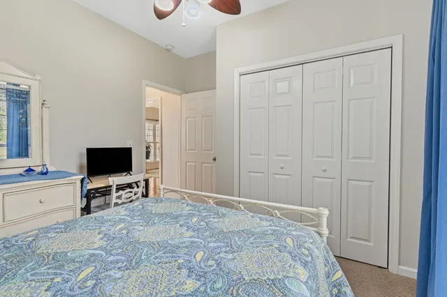 a view of a livingroom with kitchen and bathroom