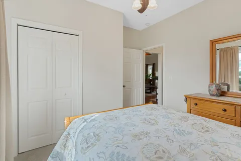 a bedroom with a bed and a dresser