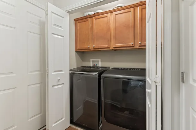 a utility room with washer and dryer