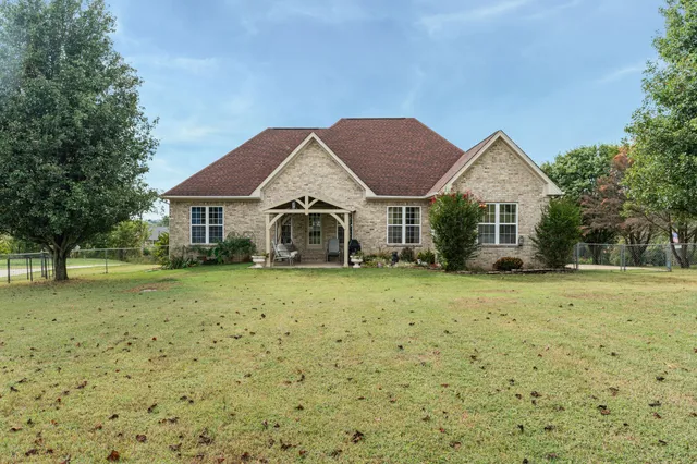a front view of a house with a yard