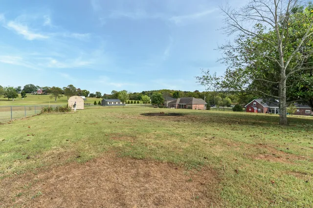 a view of a lake with houses in background