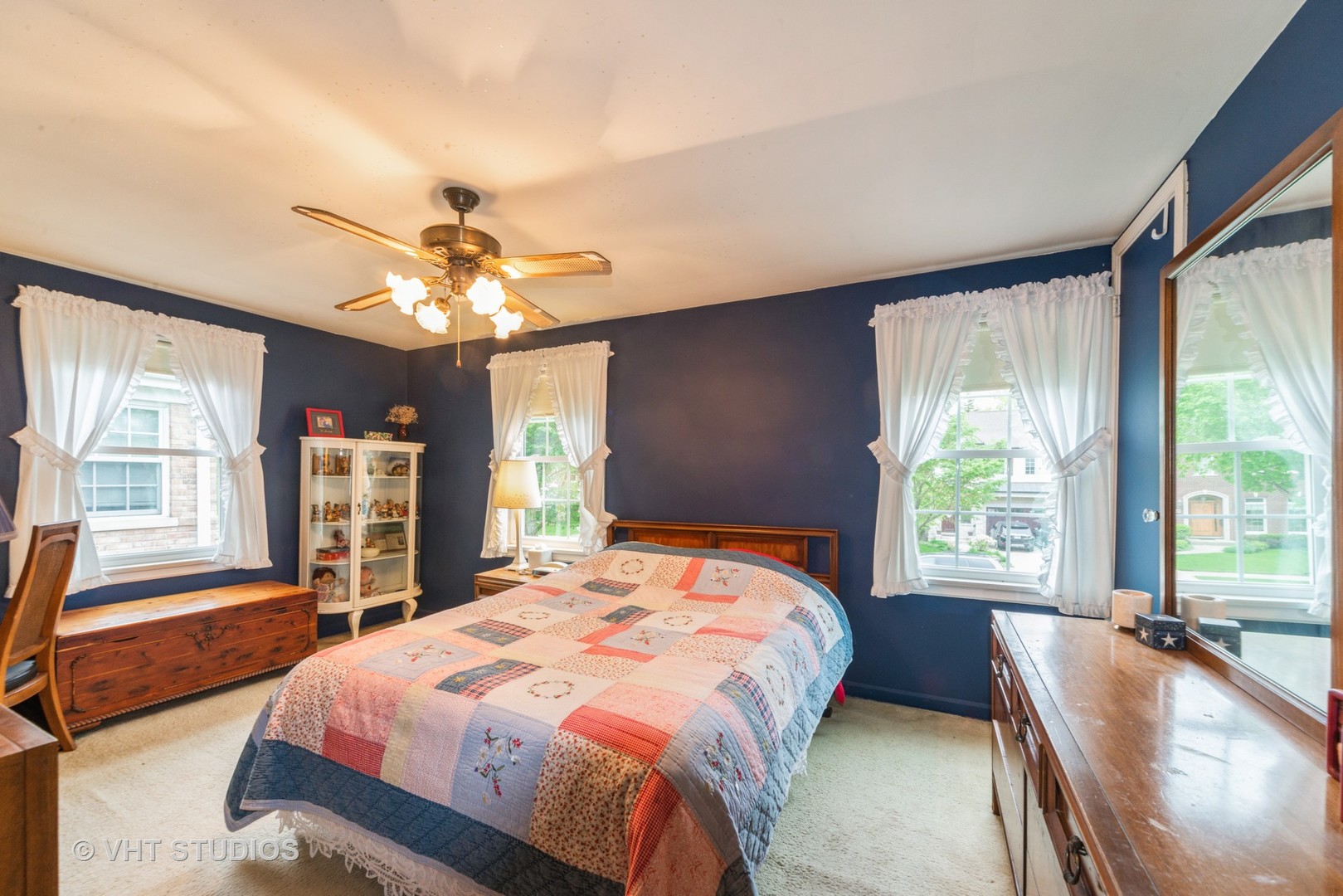 505 Warren Avenue Park Ridge, IL 60068 - Photo 11 of 21 a bedroom with a large bed and a chandelier