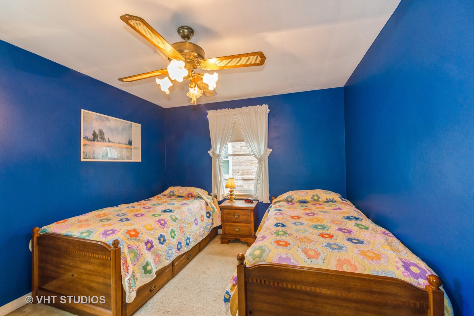 505 Warren Avenue Park Ridge, IL 60068 - Photo 13 of 21 a bedroom with two beds and a chandelier
