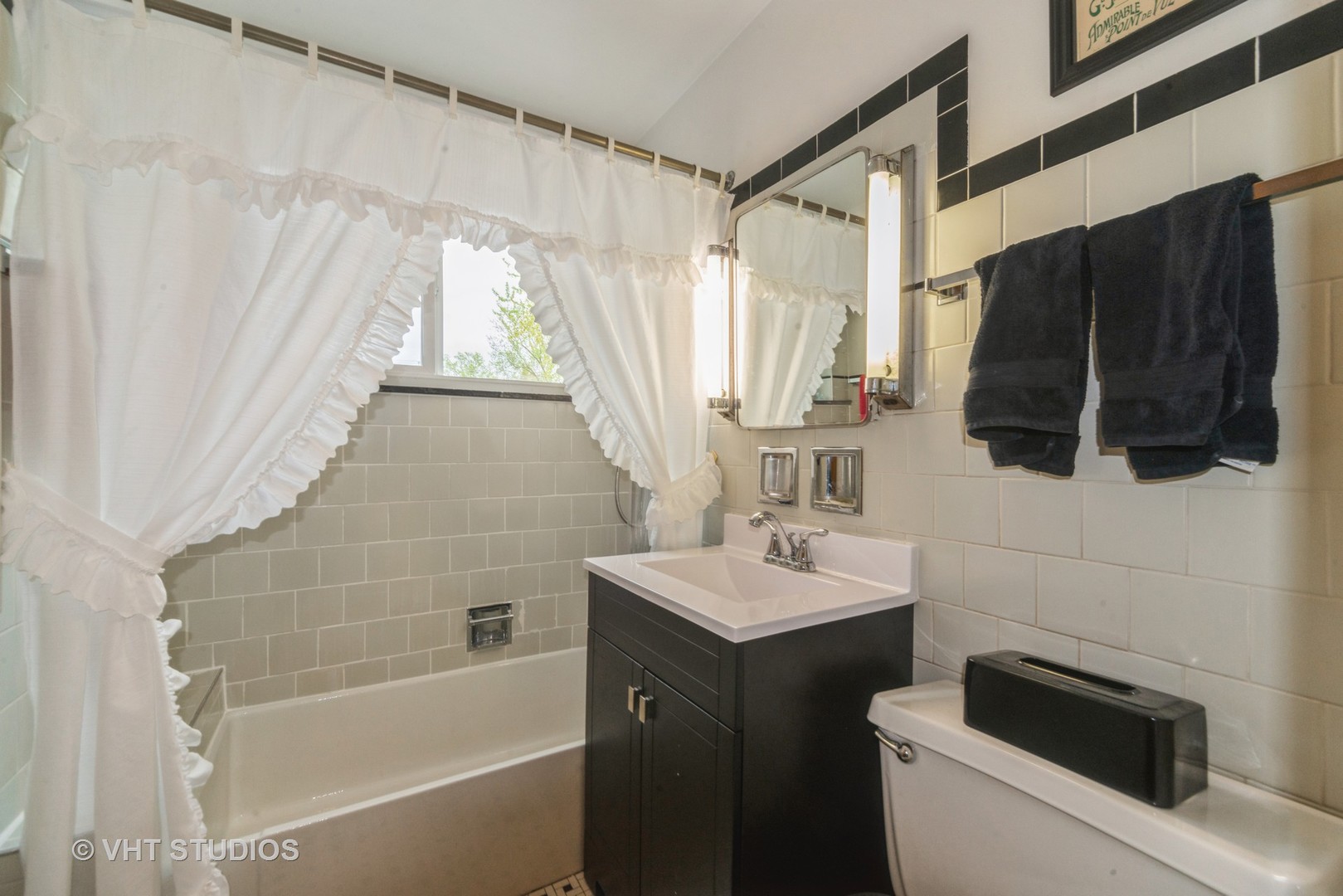 505 Warren Avenue Park Ridge, IL 60068 - Photo 14 of 21 a bathroom with a sink a toilet and shower