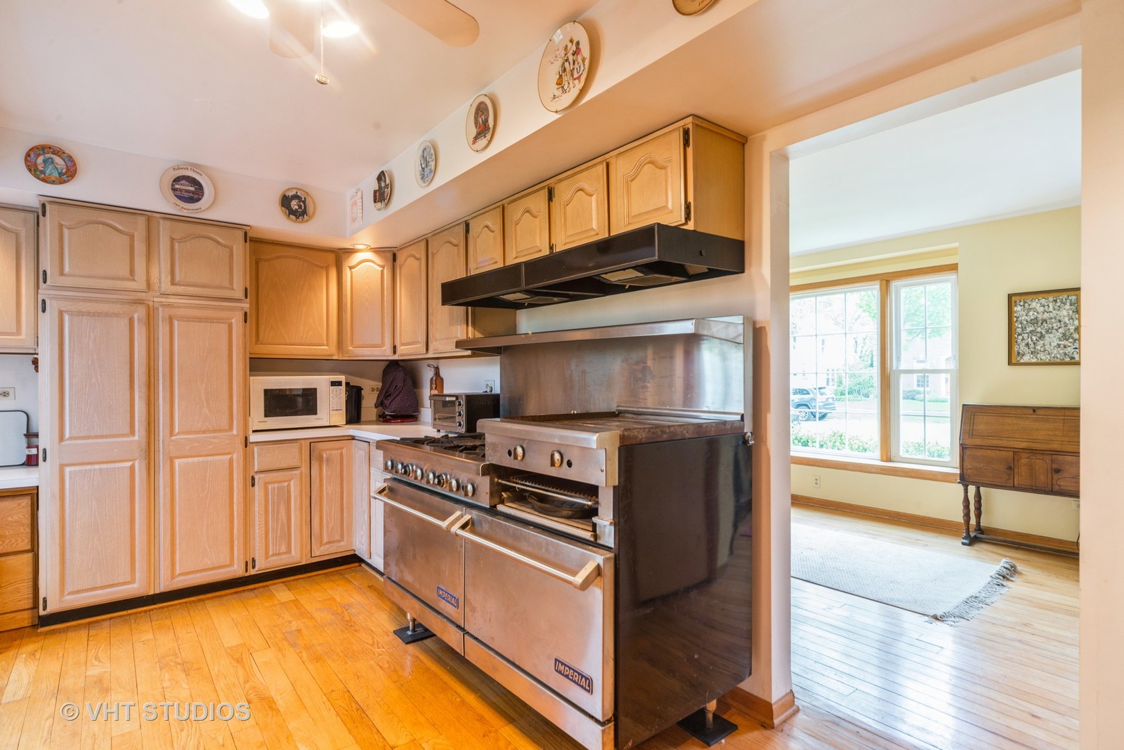 505 Warren Avenue Park Ridge, IL 60068 - Photo 5 of 21 a kitchen with stainless steel appliances granite countertop a refrigerator a stove and a sink with cabinets