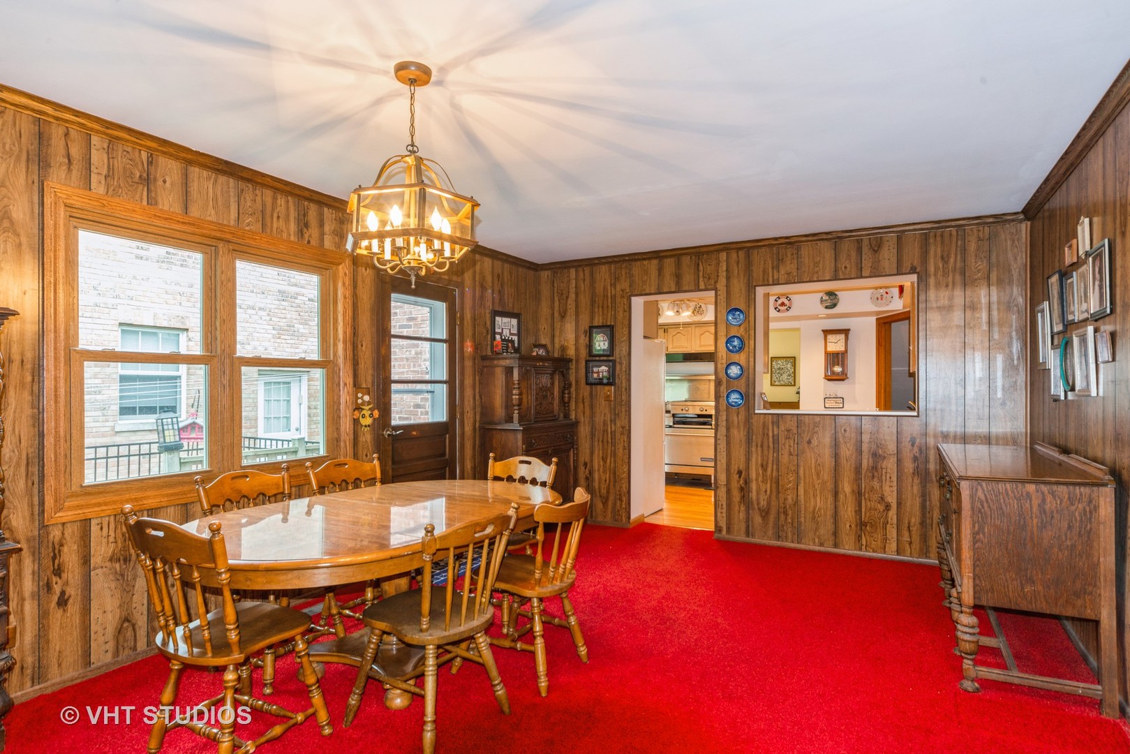 505 Warren Avenue Park Ridge, IL 60068 - Photo 7 of 21 a dining room with furniture a chandelier and wooden floor